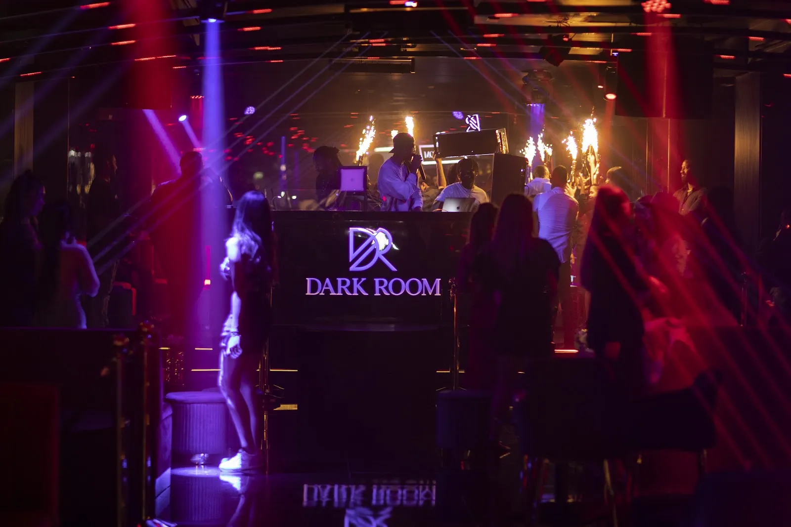 DJ booth with purple lighting and the Dark Room logo in the main room on Sheikh Zayed Road