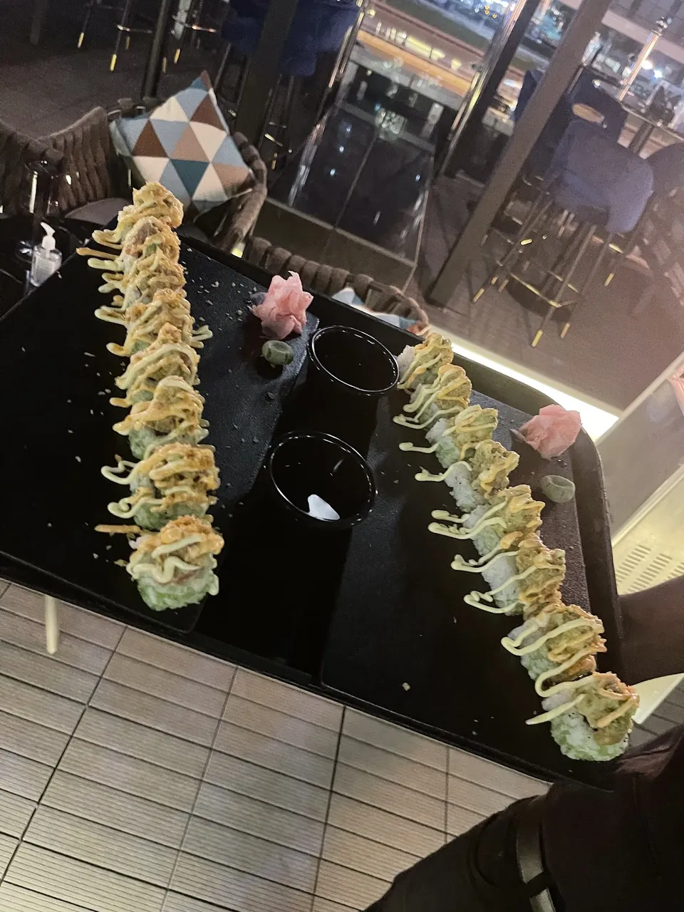 Food platter served at a terrace table overlooking Sheikh Zayed Road at Dark Room Dubai
